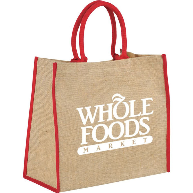 A large jute tote bag in natural brown with red handles and a logo. Ideal for carrying various items.