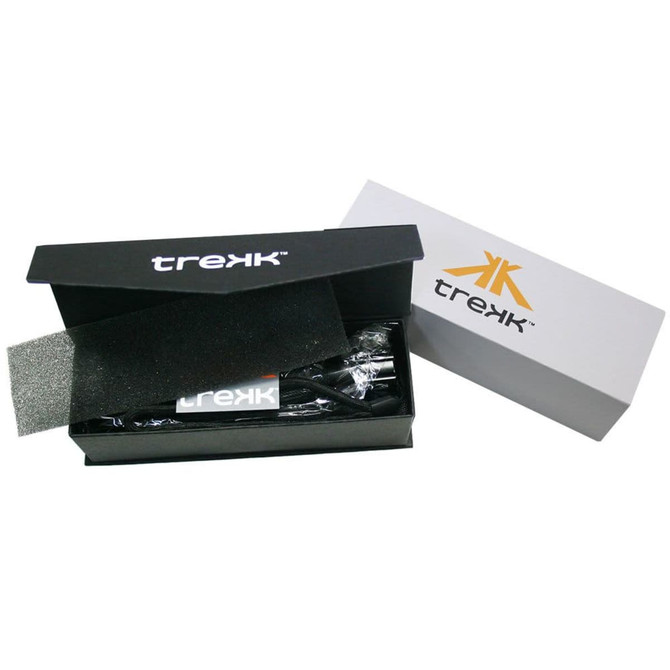 A black and silver box containing a Trekk Torch with Compass, featuring a logo on the packaging.