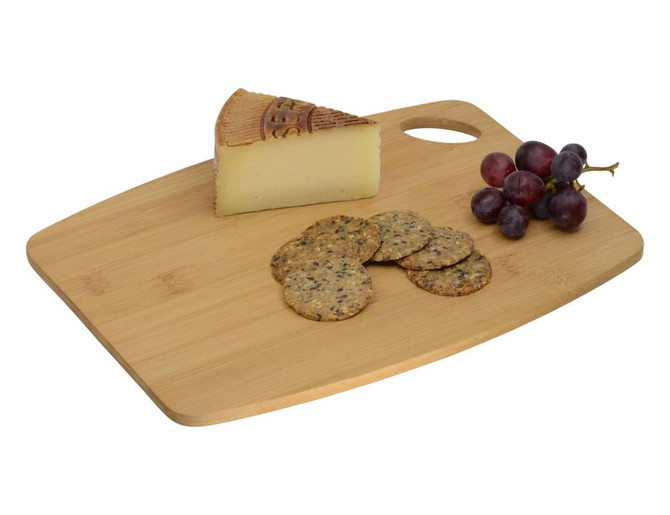 A bamboo cheese board featuring a wedge of cheese, crackers, and a bunch of grapes, with a handle and a logo.