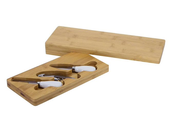 A bamboo cheese board set with white-handled cheese knives, housed in a wooden box.