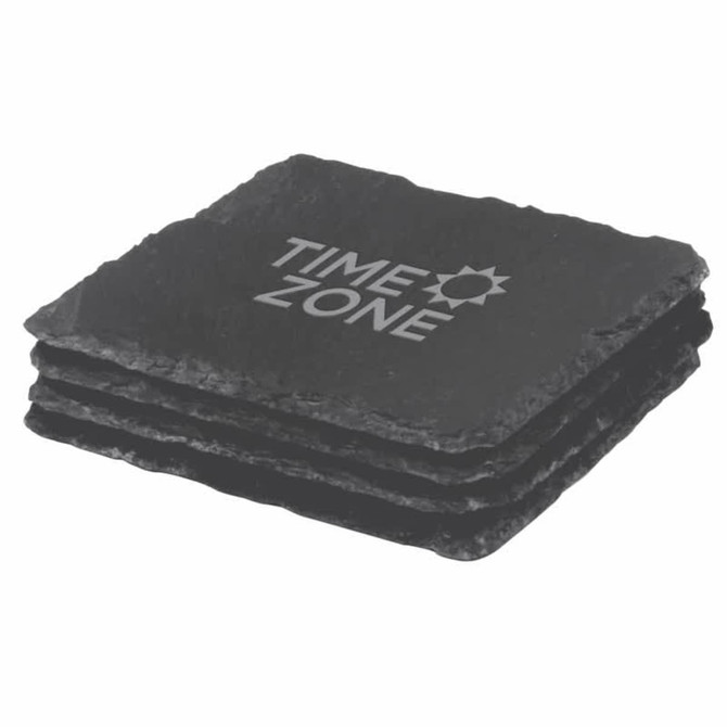 A set of four black slate coasters stacked together, featuring a logo on the top coaster.