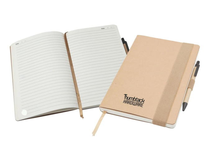 A large A5 natural notepad with lined pages, a beige cover, and an elastic band, accompanied by a pen.