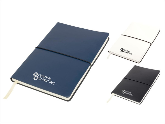 A Tango A5 notebook in navy, white, and black, featuring a logo on the cover.