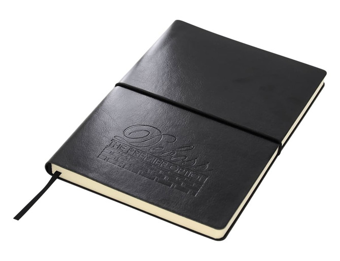 A black Tango A5 notebook with a subtle embossed design and an elastic closure.