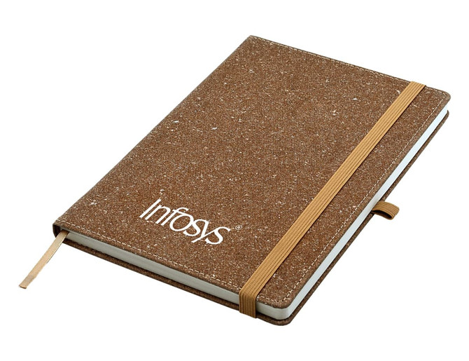 A brown bonded leather A5 notebook with an elastic band and a logo on the cover.