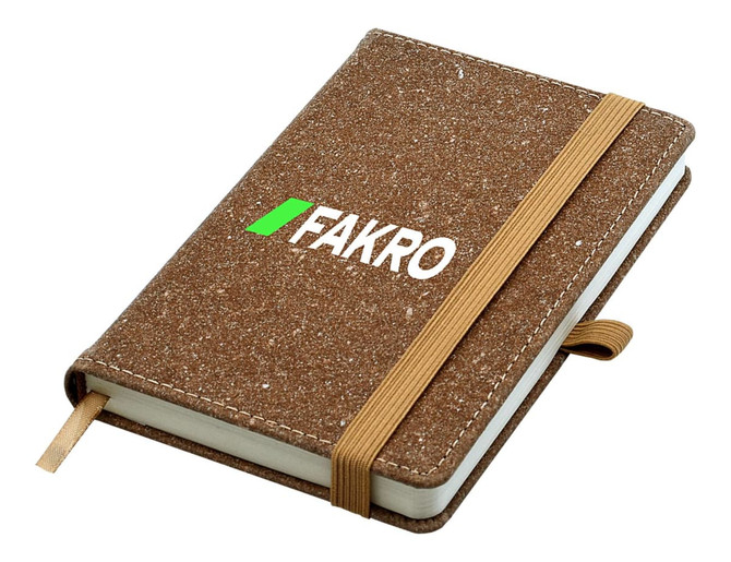 A brown bonded leather A6 notebook with an elastic band closure and a branded logo on the cover.