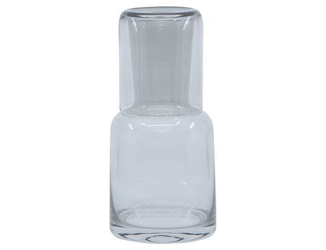 A clear glass carafe with a rounded base and a narrow neck. It has a simple, modern design.
