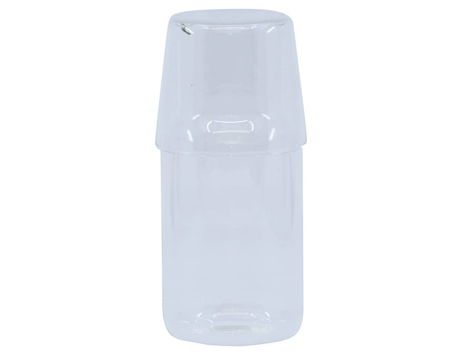 A clear glass carafe with a detachable tumbler on top, featuring a minimalist design. It has a logo.