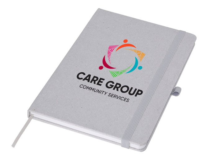 A grey A5 notebook with an elastic band closure and a logo on the front, featuring colourful graphic elements.