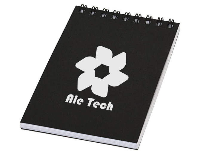 A black spiral notebook with a white logo and branding on the front cover.