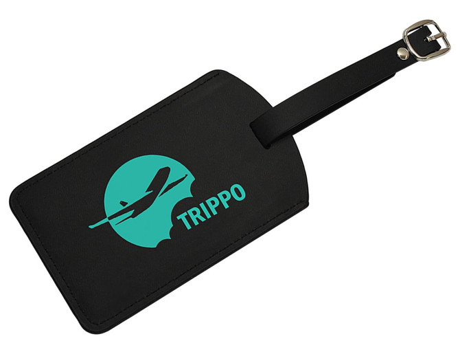 A black luggage tag featuring a turquoise logo of an airplane and the word "TRIPPO." It has a buckle strap.