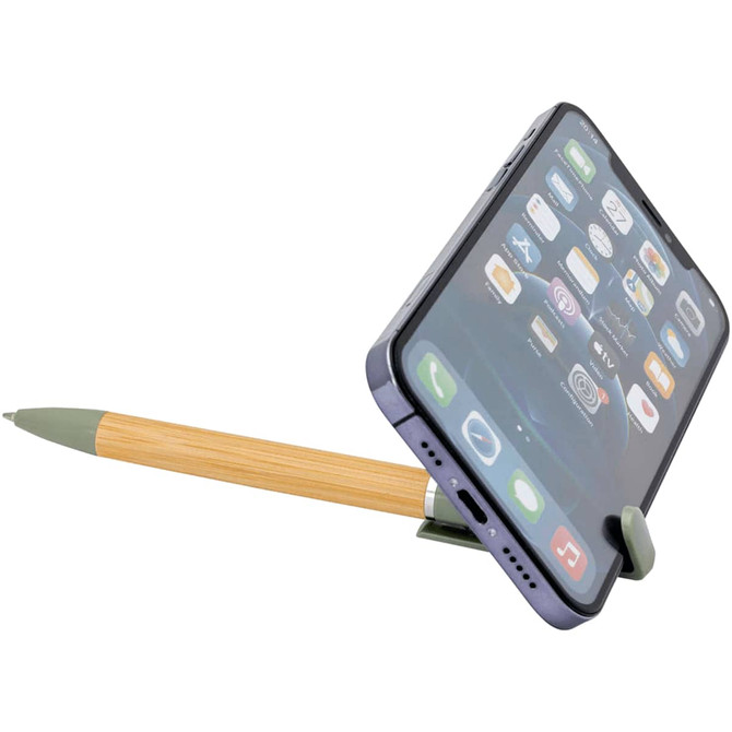 A bamboo pen with a green tip holds a smartphone at an angle, featuring various app icons on the screen.