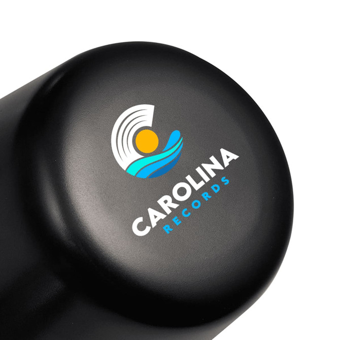 A black lamp with a rounded top featuring a logo design. The lamp is compact and rechargeable.