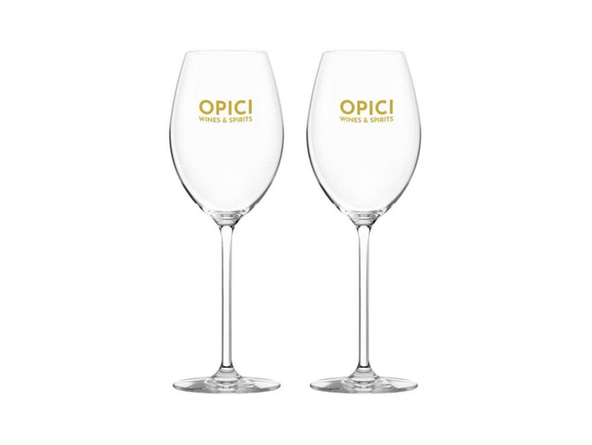 A set of two clear glass wine glasses featuring a logo in gold. Each glass has a tall stem and a wide bowl.