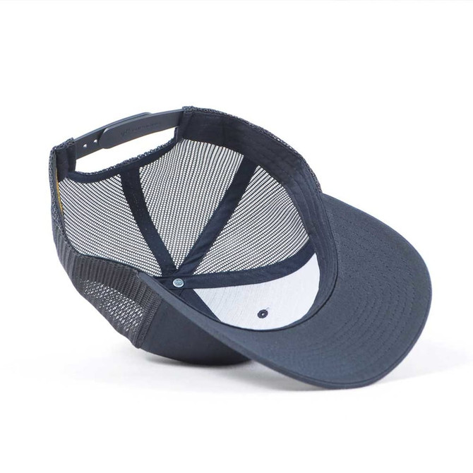 A navy trucker cap with a mesh back and a curved brim, featuring a logo on the front.