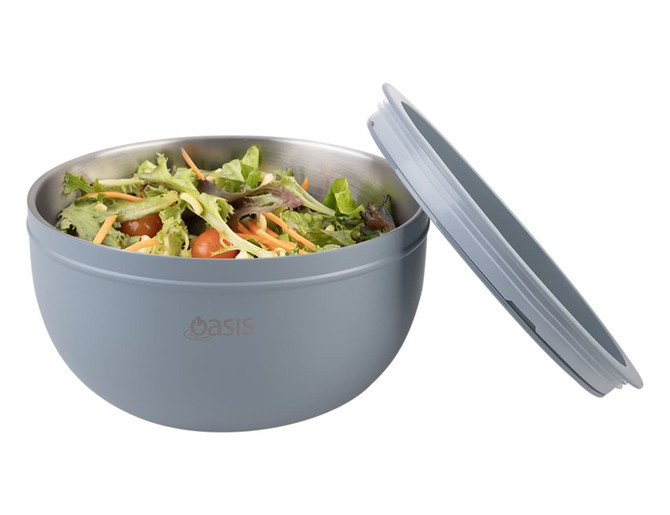 A salad bowl in light blue with a double wall design, featuring a lid and filled with mixed salad ingredients.