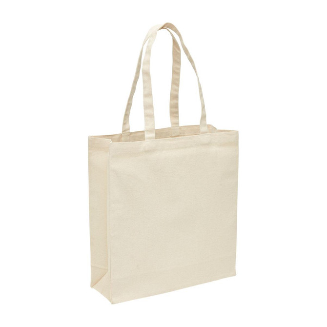 A heavy duty canvas tote bag in natural beige with a gusset for extra space and sturdy handles.