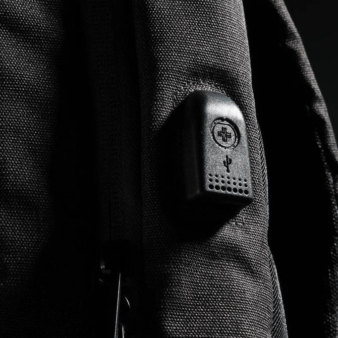 A black backpack with a textured surface and a small logo integrated into the design.