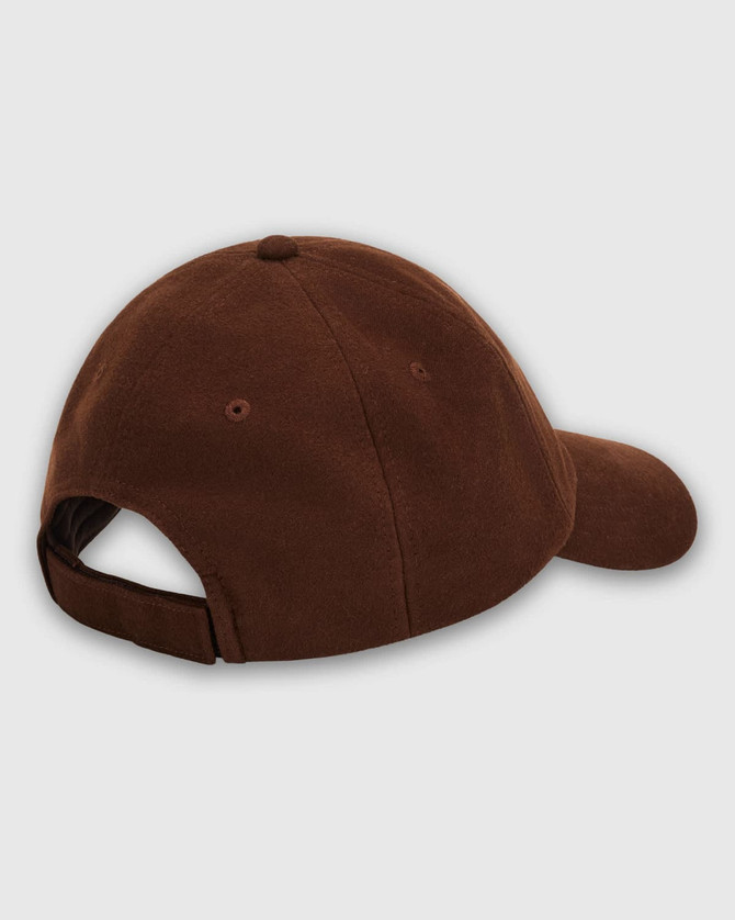 A brown cap featuring a curved brim and adjustable strap at the back, with a logo on the side.