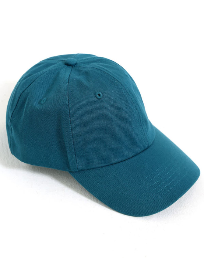 A teal cotton twill unstructured cap featuring a curved brim and an adjustable strap at the back.
