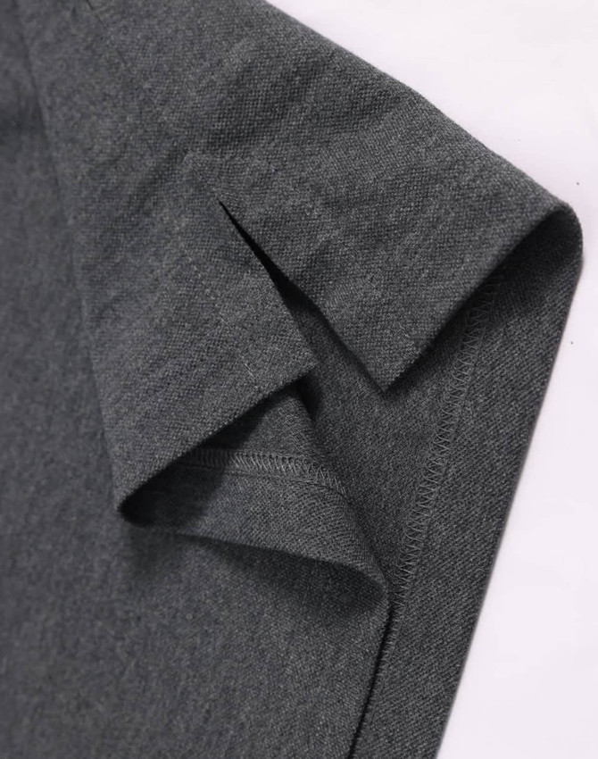 A dark grey ultrafine cotton pique polo featuring a folded sleeve detail and brand logo.