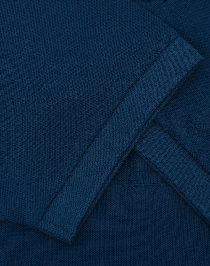 A navy ultrafine cotton pique polo with folded sleeves, featuring a logo.