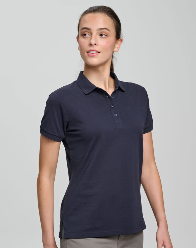 A navy ladies ultrafine cotton pique polo, featuring a classic collar and buttons, displayed on a model.