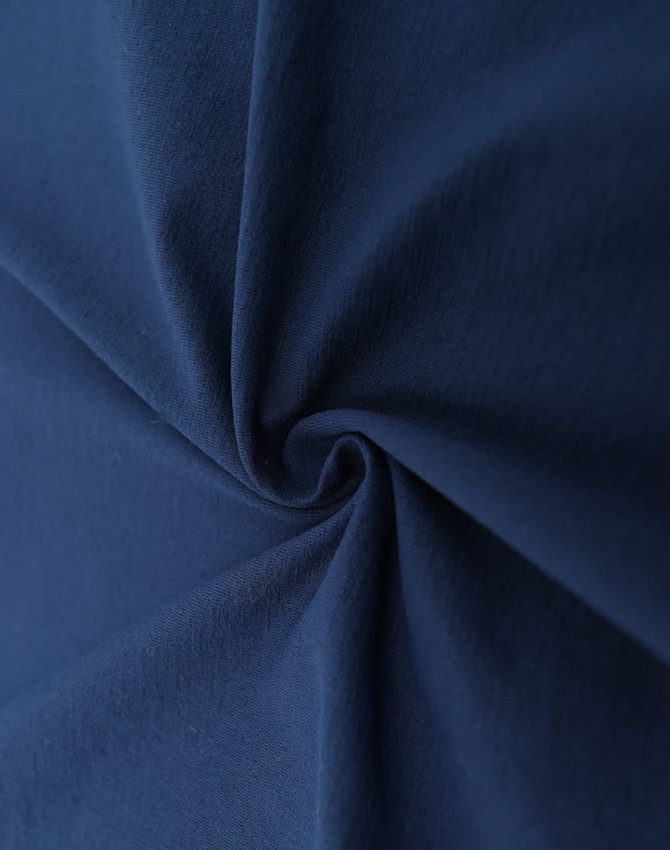 A close-up of navy blue fabric, showcasing its smooth texture and durability. The fabric has a slight sheen.