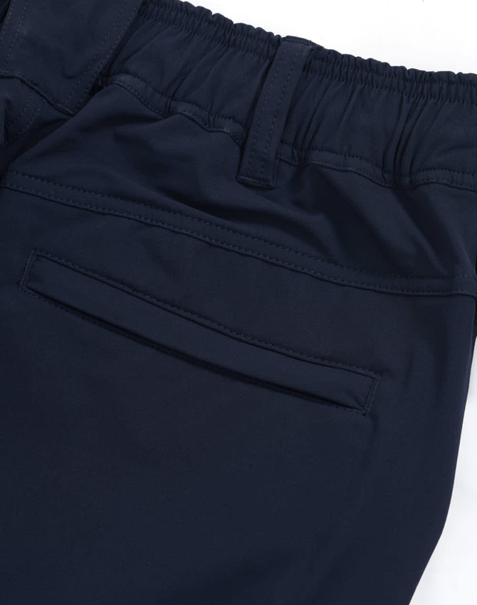 Navy blue flexi work pants featuring an elastic waistband and a rear pocket. Includes branding on the fabric.
