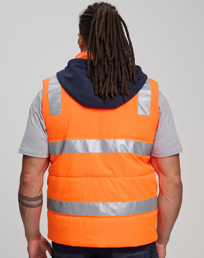 A unisex hi-vis hooded puffer vest in bright orange, featuring reflective stripes and a navy hood.