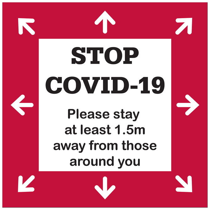 A floor decal sticker in red and white, featuring arrows and a message about maintaining social distance.