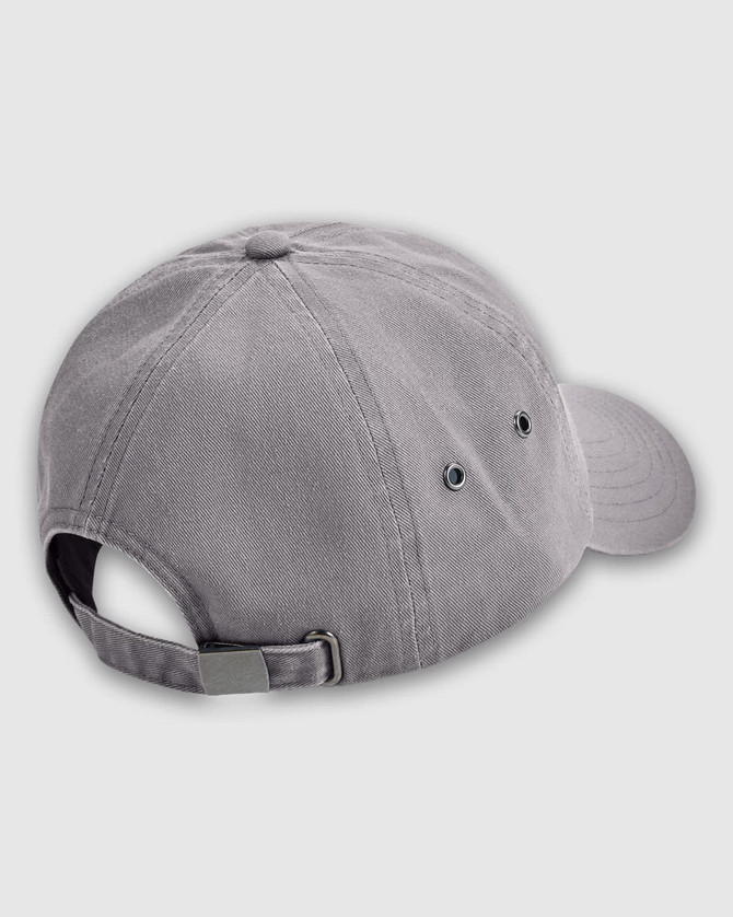 A grey washed baseball cap featuring ventilation holes and an adjustable strap at the back. It has a logo.
