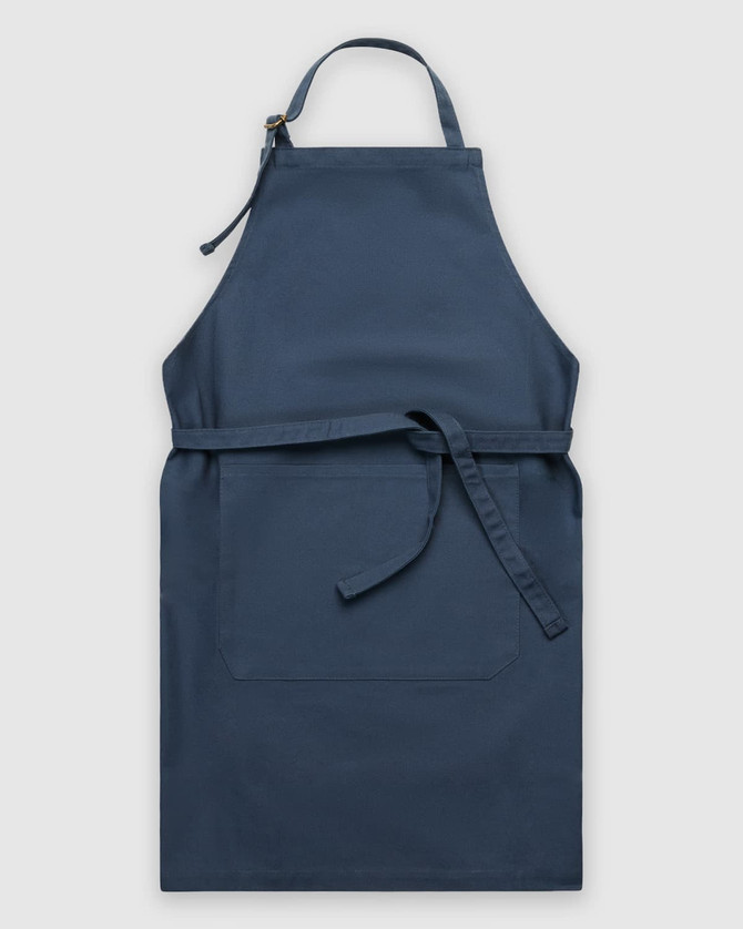 A navy blue apron with a pocket and a tie belt, featuring a simple design and no visible branding.