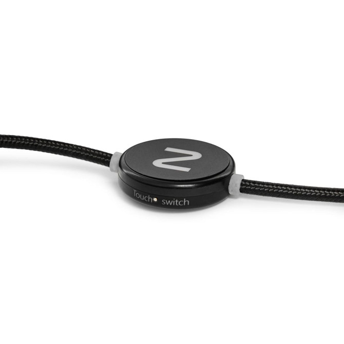 A black charging cable with a round switch feature and a textured exterior. It includes a logo on the switch.