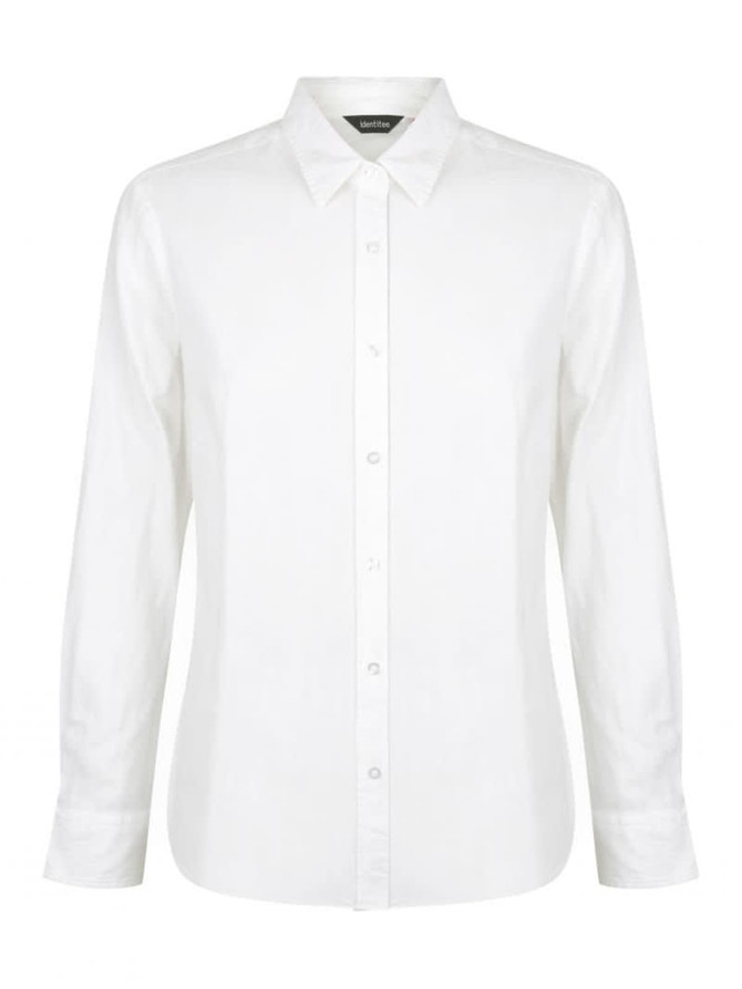 A white ladies long sleeve button-up shirt featuring a collar and a logo on the label.