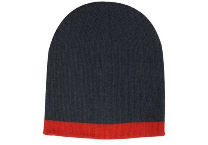 A two-tone cable knit beanie in grey with a red cuff. The beanie features a textured design and has a logo.