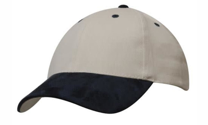 A cap featuring a brushed heavy cotton body in cream with a navy suede peak, complete with a logo.