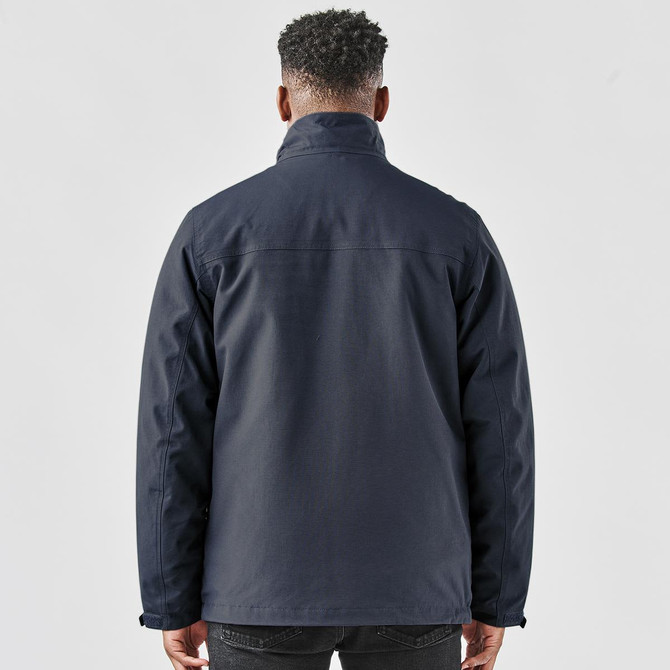 A navy men's jacket with a high collar, featuring a logo on the back.