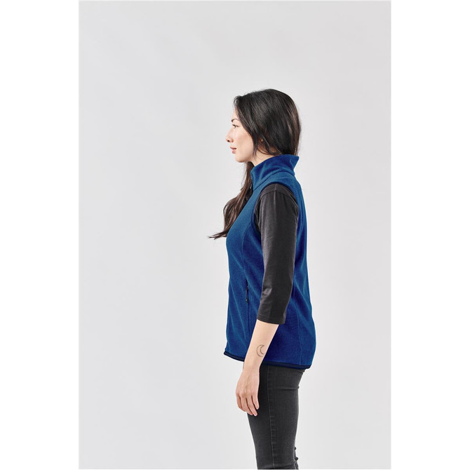 A side view of a women's navy blue vest with a high collar and a logo on the front.