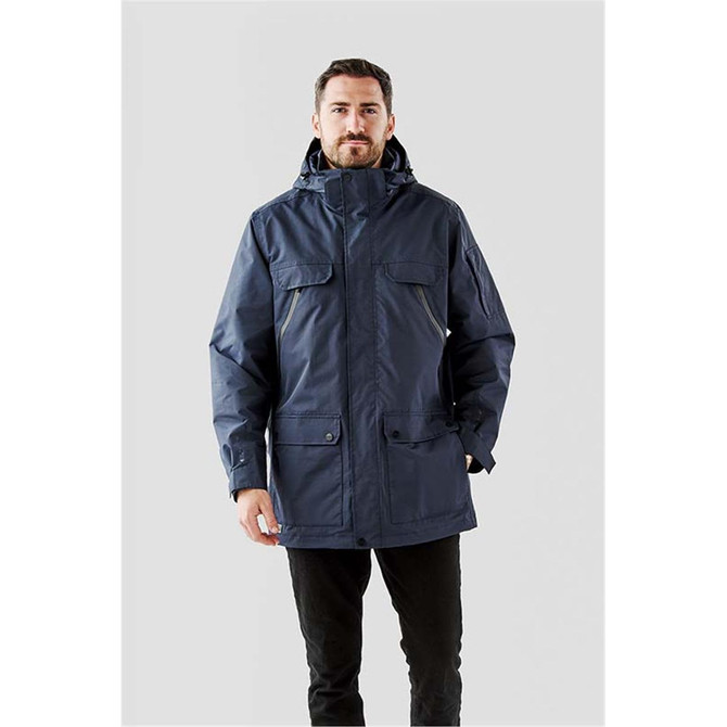 A navy men's Fairbanks 5-in-1 system jacket with a hood and multiple pockets. Features a logo on the sleeve.