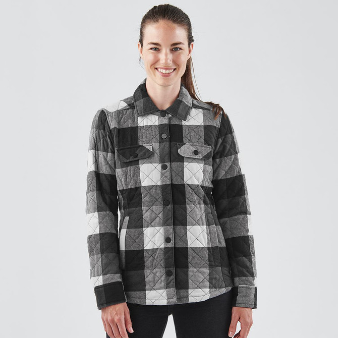 A women's black and grey plaid shacket with a button-up front and two chest pockets, featuring a logo.