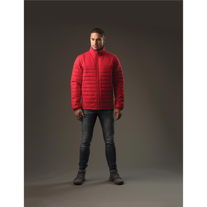 A red quilted jacket with a high collar, modeled by a person standing against a dark background.