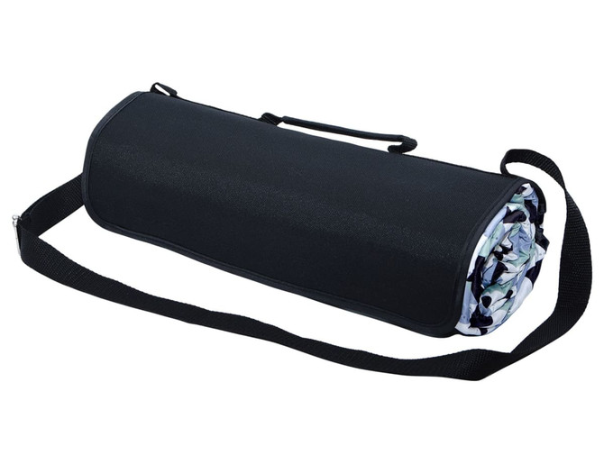 A rolled-up picnic rug in black with a patterned interior, featuring a carrying strap for easy transport.