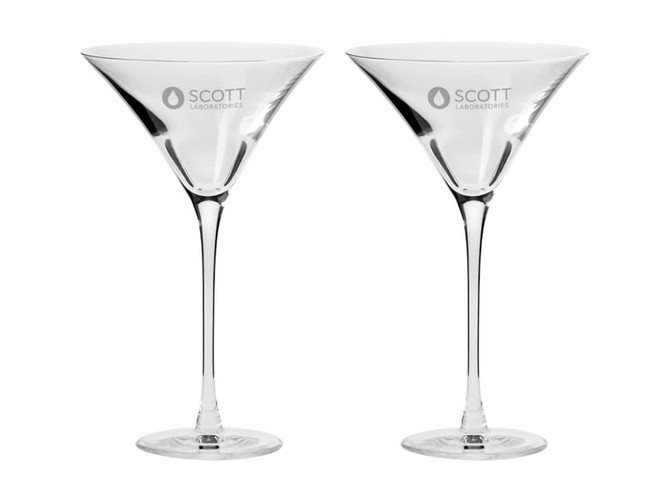 Two elegant clear martini glasses with a distinctive shape, arranged side by side, featuring a branding logo.