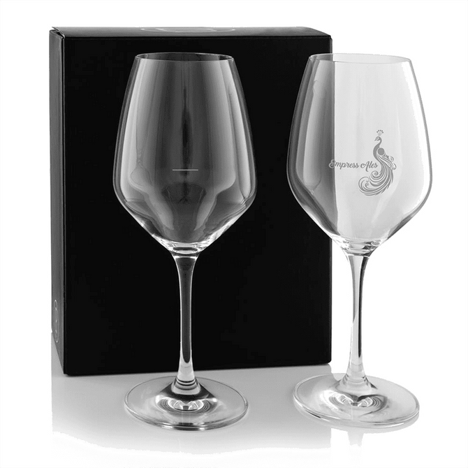 A twin pack of elegant wine glasses in clear glass, presented in a black box. One glass features a logo.