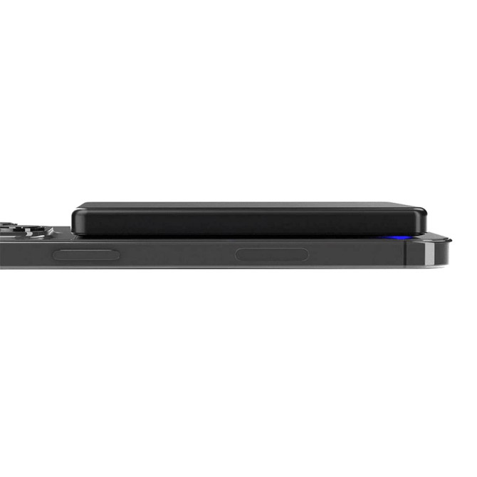 A slim black metal power bank positioned on a mobile device, featuring a sleek design and a logo.
