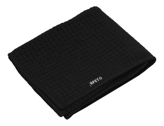 A folded black golf towel with a textured pattern and a small logo.