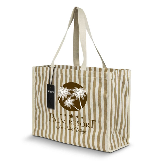 A striped beige and white tote bag with palm tree design and branding. It has two handles for carrying.