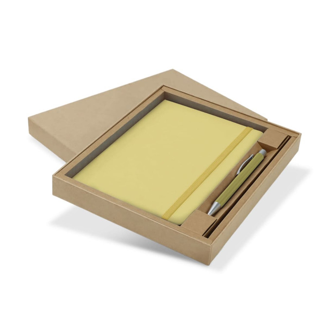 A gift set featuring a yellow notebook and a silver pen, presented in a cardboard box.