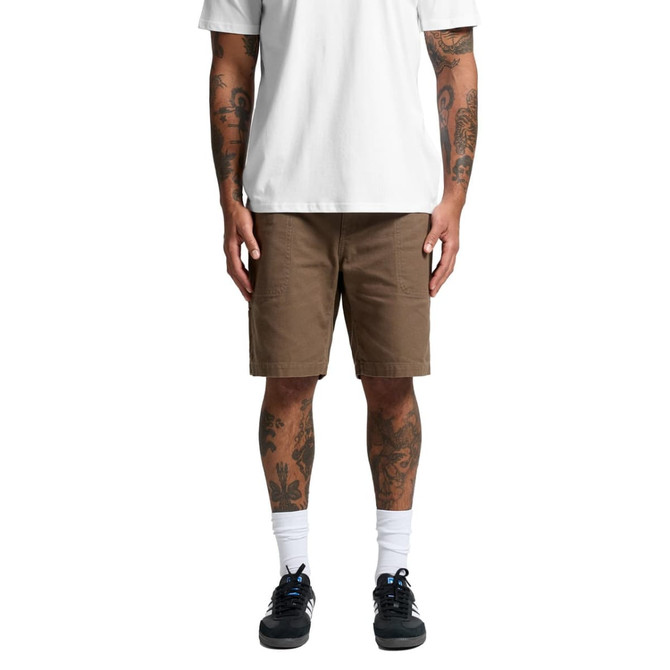 Cotton cargo shorts in a light brown colour, featuring multiple pockets, worn by a person with tattoos.
